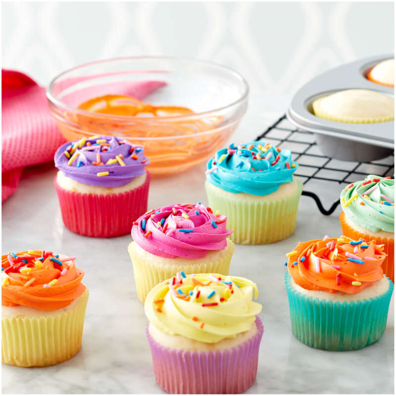 https://www.thepeppermillinc.com/wp-content/uploads/2021/06/415-0-0067-Wilton-Pastel-Rainbow-Cupcake-Liners-150-Count-L1.jpg